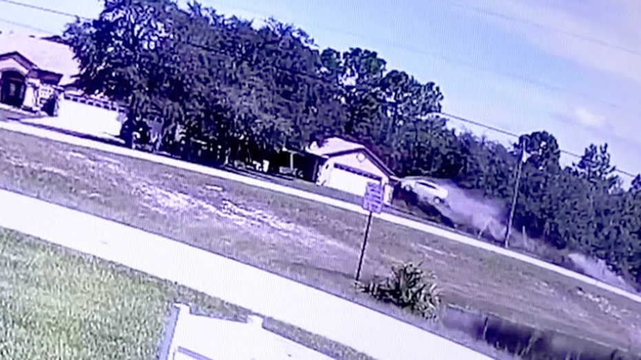 Still image from neighbor's security camera showing deadly crash