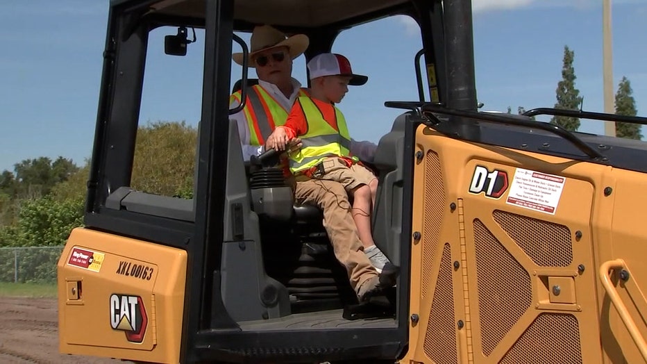 Photo: 4-year-old Owen Hart rides in Cat heavy equipment.