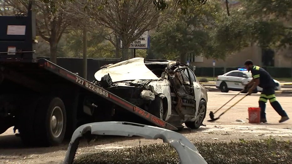 Photo: Demond Perry's vehicle being towed following the fiery crash