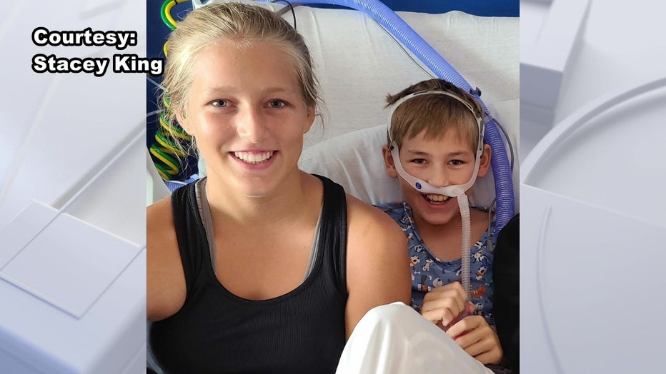 Colton King and sister in hospital bed.