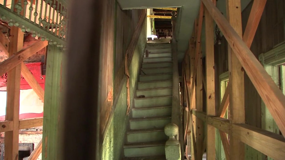 Stairs lead up to a second story in the now-crumbling Jackson House. 