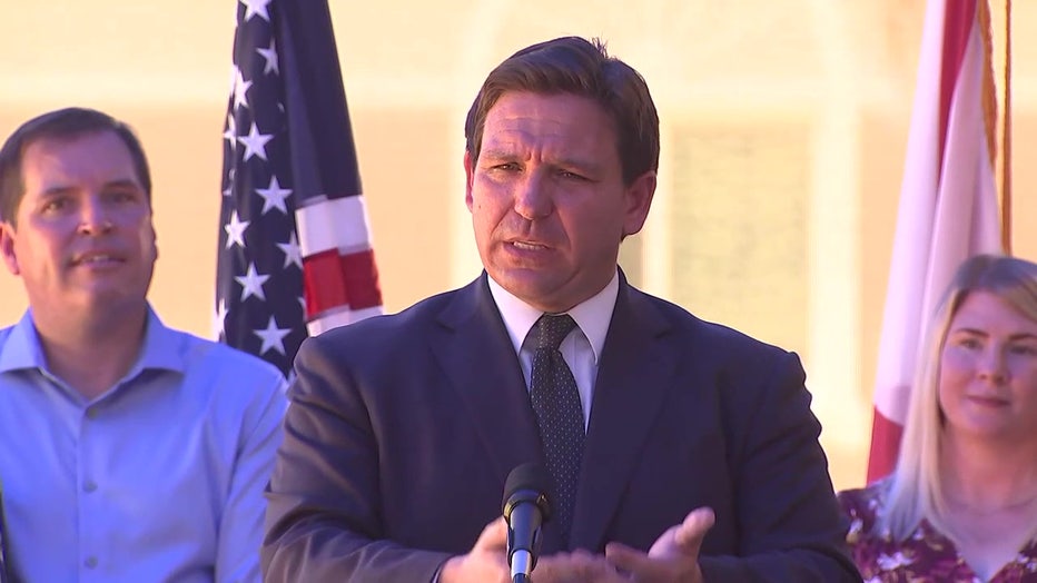 Ron DeSantis speaking at a podium