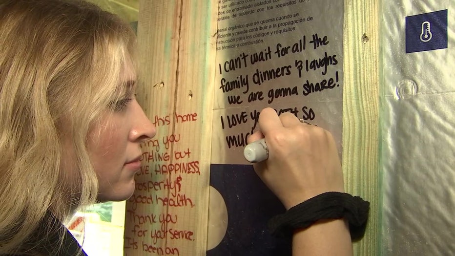 Friends and family of John Borders wrote messages on the walls of the new home.