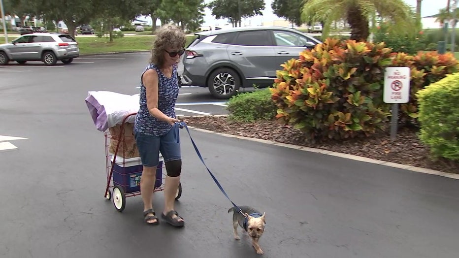 On Tuesday, as Hurricane Ian got closer to the Tampa Bay area, Gini Roberts and her dog Harry checked in at the Hilton Garden Inn.