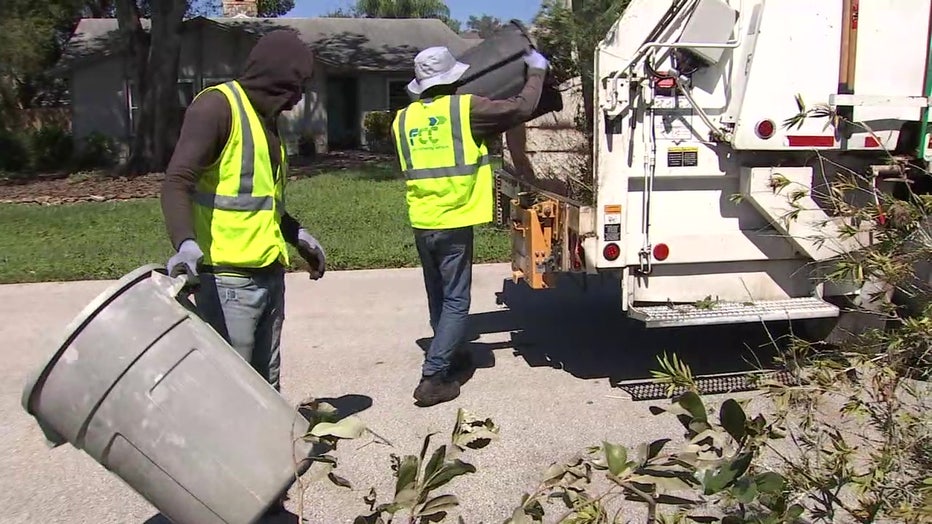 Crews in Polk County begin picking up debris left behind by Hurricane Ian. 