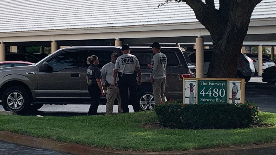 Officials stand outside a Bradenton apartment complex where a person was killed in an explosion Wednesday afternoon.