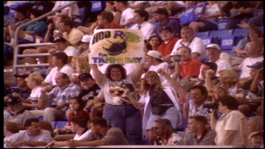 Photo: A Tampa Bay Rays fan holds up a sign that reads, 'Hoo Rays for Tampa Bay' during the first home opener game on March 31, 1998. 
