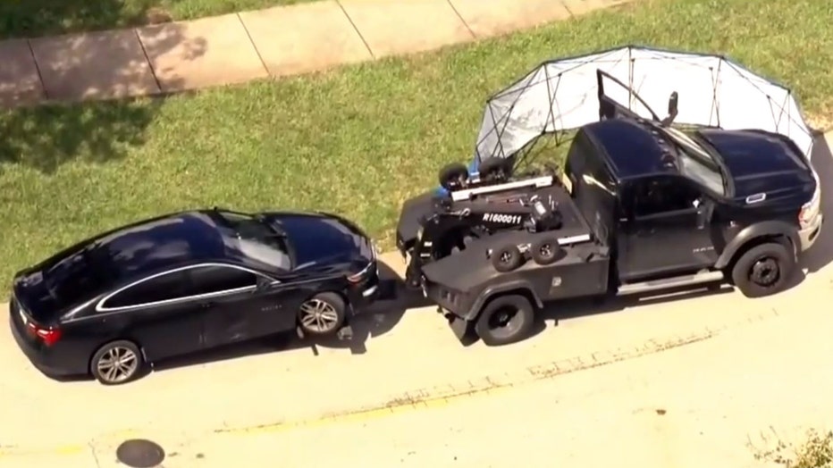 Photo: Aerial image of the crime scene where a police say a tow truck driver shot and killed a man during a confrontation over a car repossession in a South Florida neighborhood.