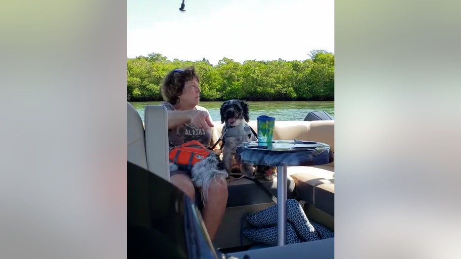 mother points at safety vest on boat venice