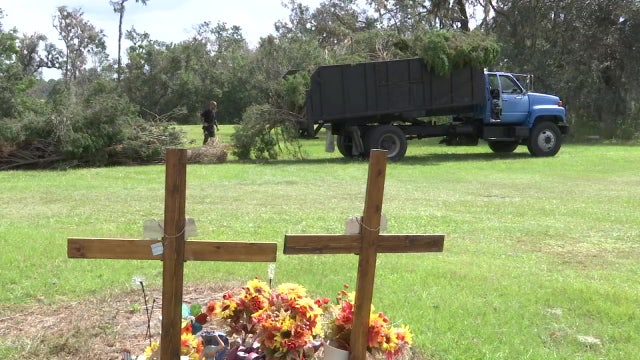 Volunteers help clean up Wimauma historic cemetery after Hurricane Ian