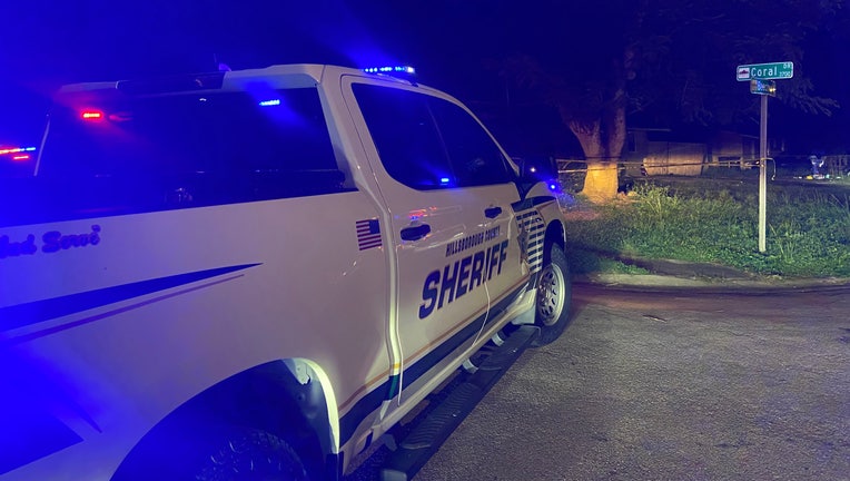 A Hillsborough County Sheriff's Office truck with light on. 