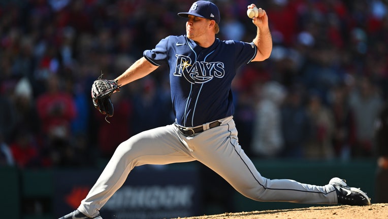 Garrett Cleavinger #60 of the Tampa Bay Rays pitches in the tenth inning during the Wild Card Series game between the Tampa Bay Rays and the Cleveland Guardians at Progressive Field on Saturday, October 8, 2022 in Cleveland, Ohio.