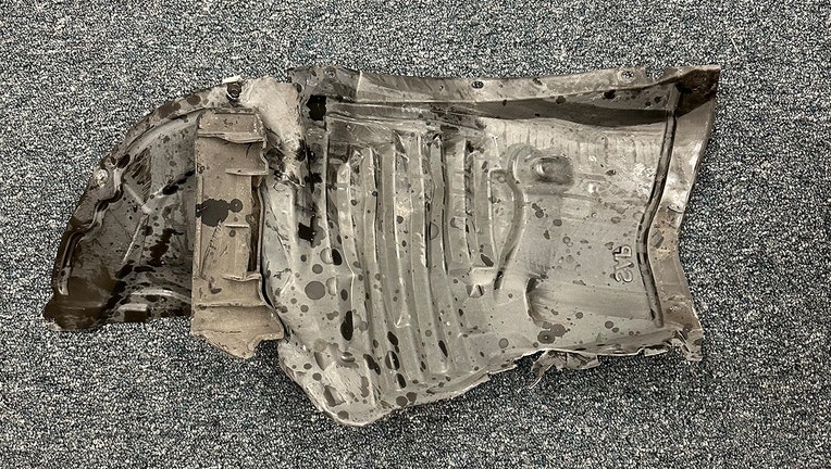 Piece of suspect's vehicle following deadly hit-and-run crash.