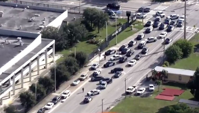 Photo: Aerial photo showing large police presence outside Miami Central High School after a "swatting" call reported an active shooter at the school.
