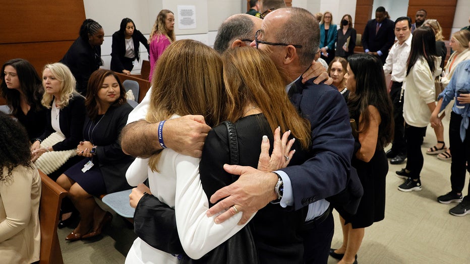 Photo: Linda Beigel Schulman, Michael Schulman, Patricia Padauy Oliver and Fred Guttenberg embrace as families of the victims enter the courtroom for the verdict in the penalty phase of the trial of Marjory Stoneman Douglas High School shooter Nikolas Cruz at the Broward County Courthouse in Fort Lauderdale on Thursday, Oct. 13, 2022.