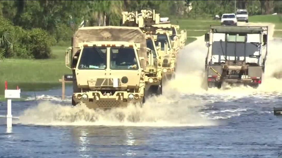 High water vehicles drive through flooded streets of North Port after Hurricane Ian