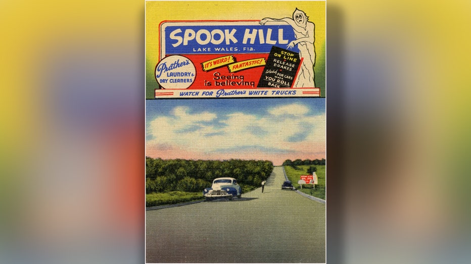 A photo from 1950 advertising Spook Hill. One could drive their car to the bottom of the "hill", turn off the engine, release the brakes and watch as the car rolled back as much as 100 feet up the hill. This is due to an optical illusion. Courtesy of the Florida Memory Project.