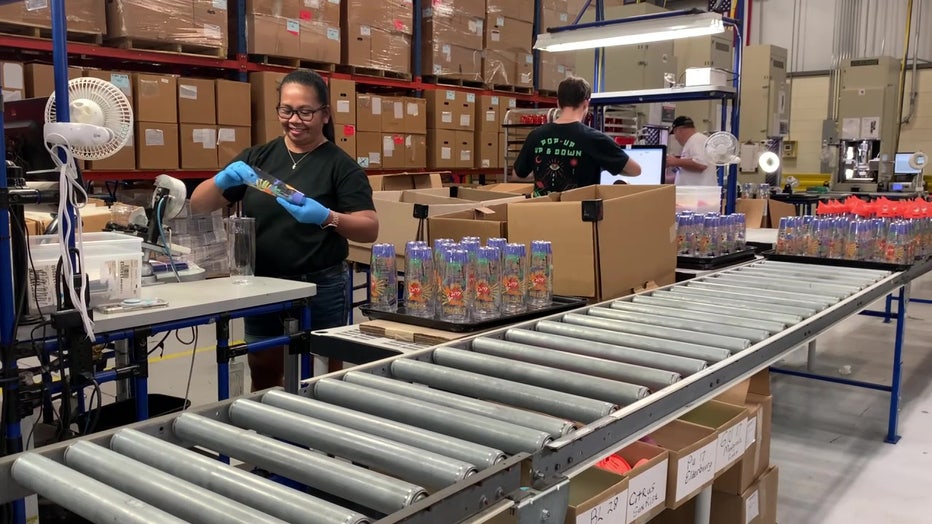 Employees at Tervis working on assembly line. 