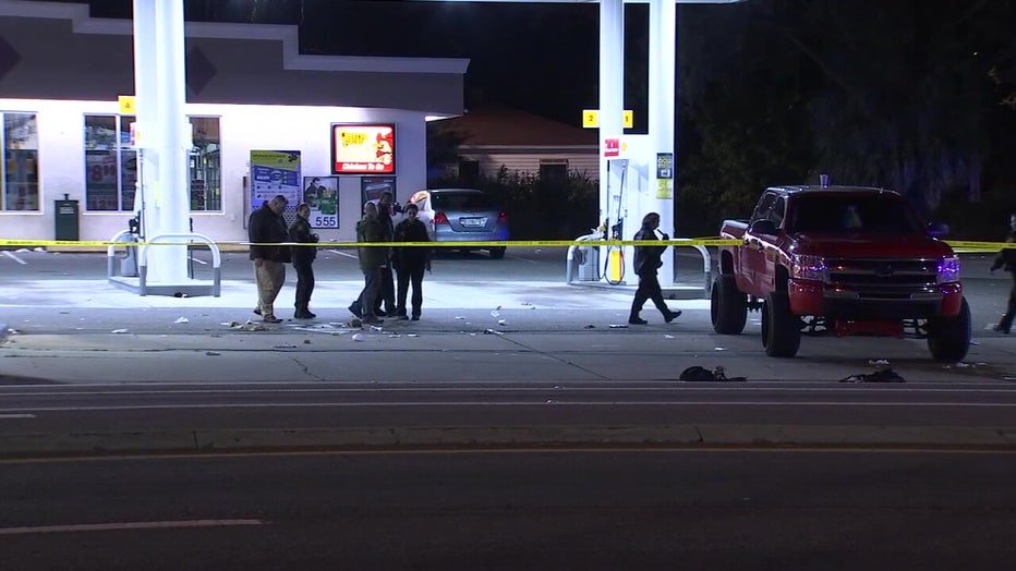 Police investigating at a gas station following the shooting. 