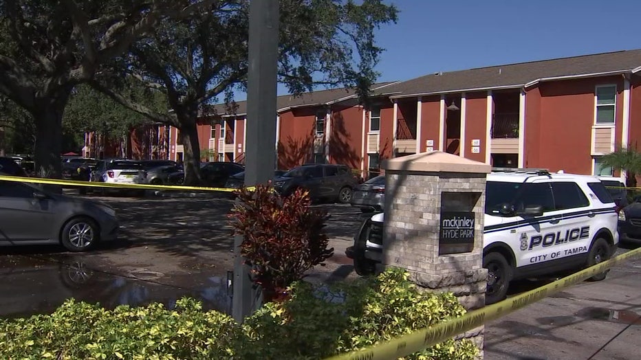 Crime scene tape in front of apartment complex