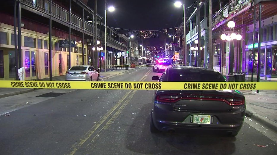 Crime scene tape and a police car in Ybor City following a shooting. 