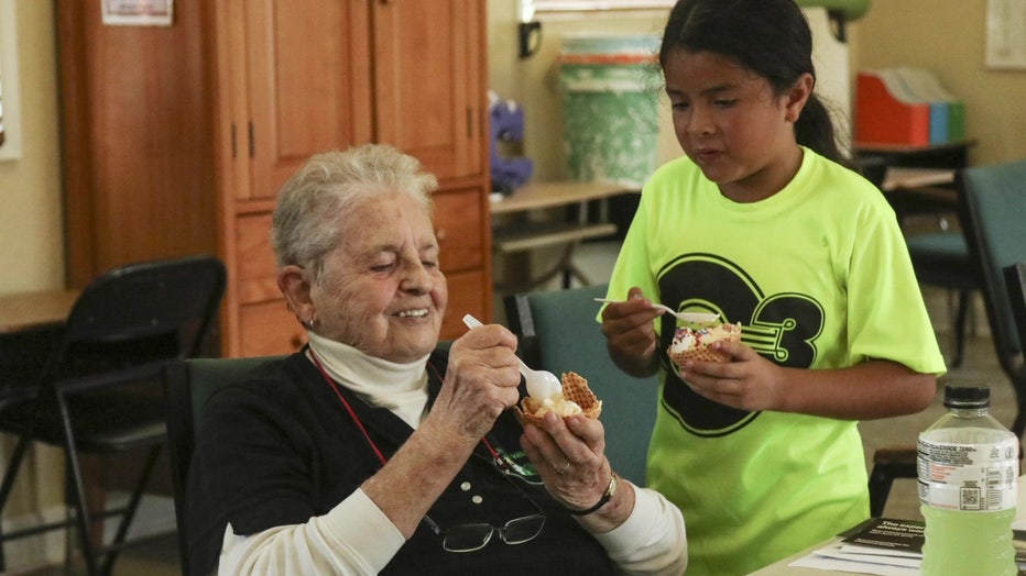Sister Clarie with a child.