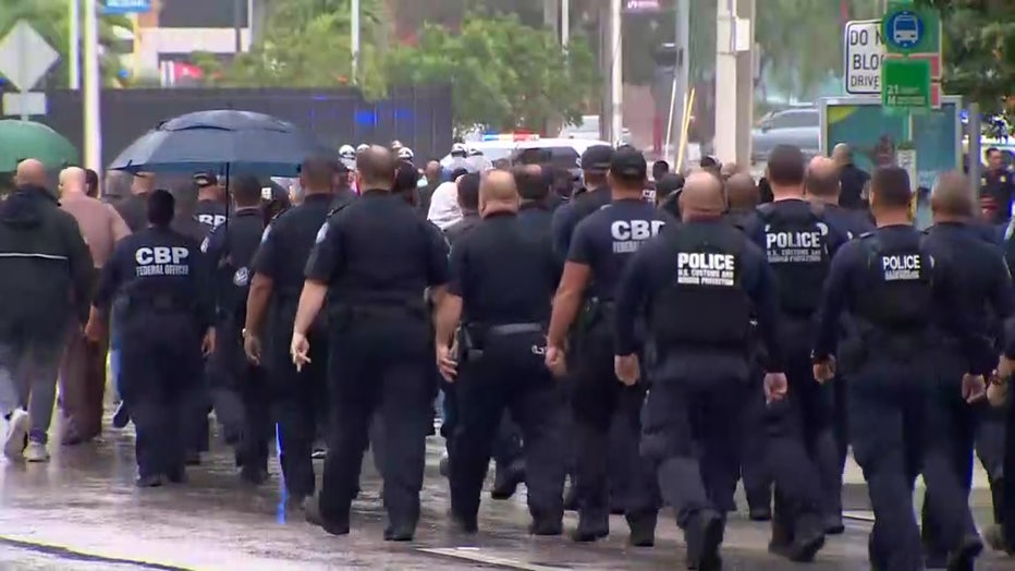 Photo: Customs and Border Protection officers along with other law enforcement officers throughout South Florida joined in a procession in Miami as the body of fallen officer Jorge Arias was brought to the Medical Examiner's Office.