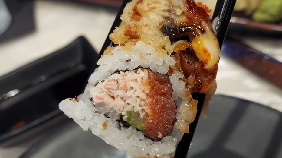 Photo: Close-up of the 'Good Fortune' sushi roll, which has snow crab, spicy tuna, asparagus topped with tempura eel.
