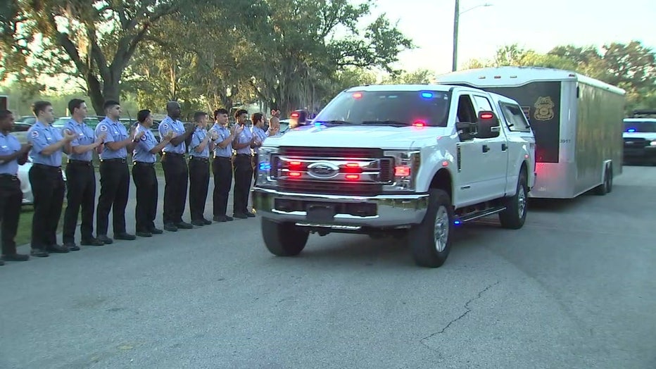 Photo: First responders line the street to see off the second wave of officers from the Tampa Police Department who are deploying to North Port for Hurricane Ian relief.