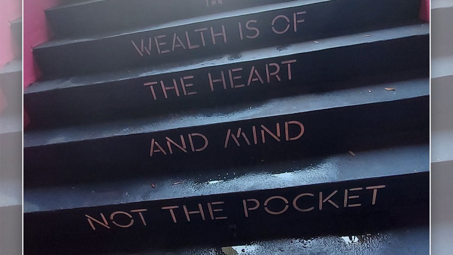 Photo: 'Wealth is of the heart and mind not the pocket' written on steps at Good Fortune's entrance