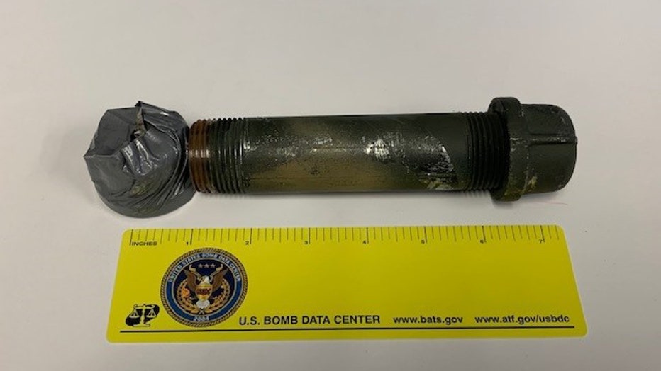 According to the ATF, the disassembly and examination of the device revealed a metal pipe that was sealed at both ends (with end caps) and filled with suspected pyrotechnic powder, with a suspected pyrotechnic fuse inserted into one of the end caps. The pipe was taped to suspected mixed explosive materials.