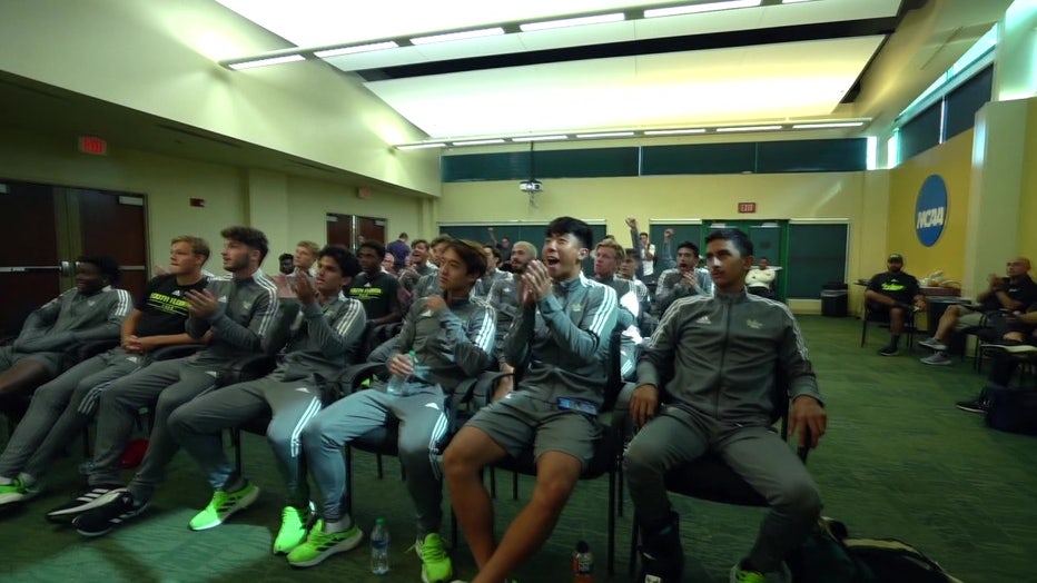 The USF men's soccer team cheers as they hear they are going to the NCAA Tournament.