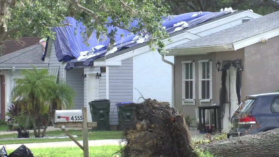 A home in North Port still has a tarp on its rook two months after Hurricane Ian. 