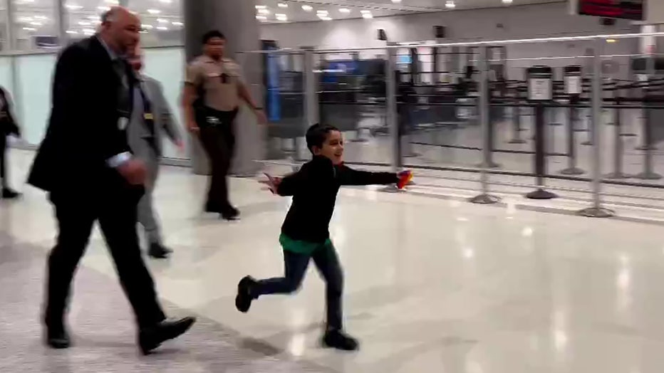 6-year-old Jorge "JoJo" Morales runs to his mother at Miami International Airport.