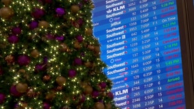 Travelers open Christmas presents at the airport after days trapped by weather delays