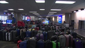 Thousands of bags pile up in Tampa International Airport's baggage claim after Christmas weekend