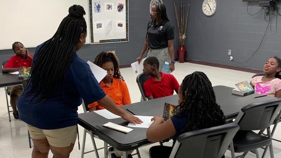 ‘Badges and Books’ program bridges community gap with literacy