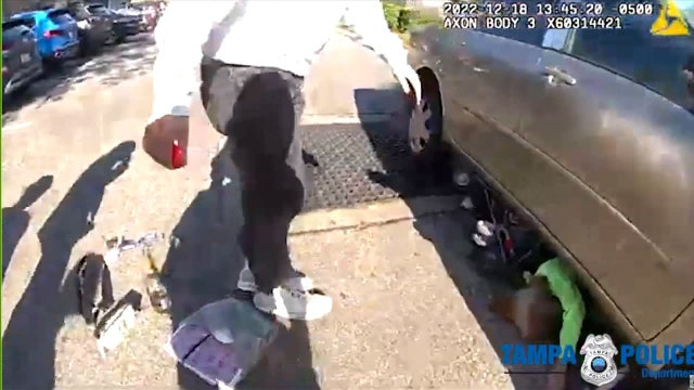 Watch: Good Samaritans, police help great-grandmother, child trapped under car in Tampa parking lot