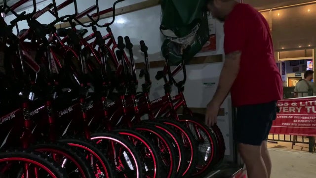 Volunteers assemble bikes for first graders at Riverview Elementary School