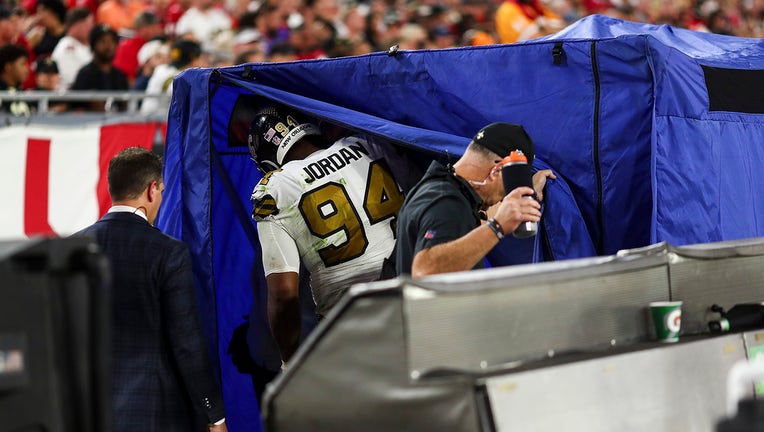 Cameron Jordan #94 of the New Orleans Saints walks into the injury tent on the sidelines during the fourth quarter of an NFL football game against the Tampa Bay Buccaneers at Raymond James Stadium on December 5, 2022 in Tampa, Florida.