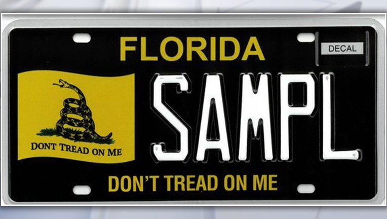 New Florida license plate with Gadsden Flag design, featuring coiled snake on yellow flag with "Don't Tread On Me" slogan