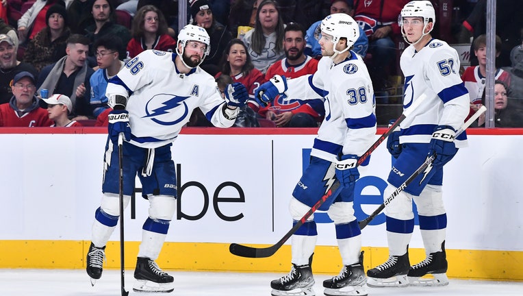 Nikita Kucherov #86 of the Tampa Bay Lightning celebrates his goal with teammate Brandon Hagel #38 during the third period of their game against the Montreal Canadiens at Centre Bell on December 17, 2022 in Montreal, Quebec, Canada. The Tampa Bay Lightning defeated the Montreal Canadiens 5-1. (Photo by Minas Panagiotakis/Getty Images)