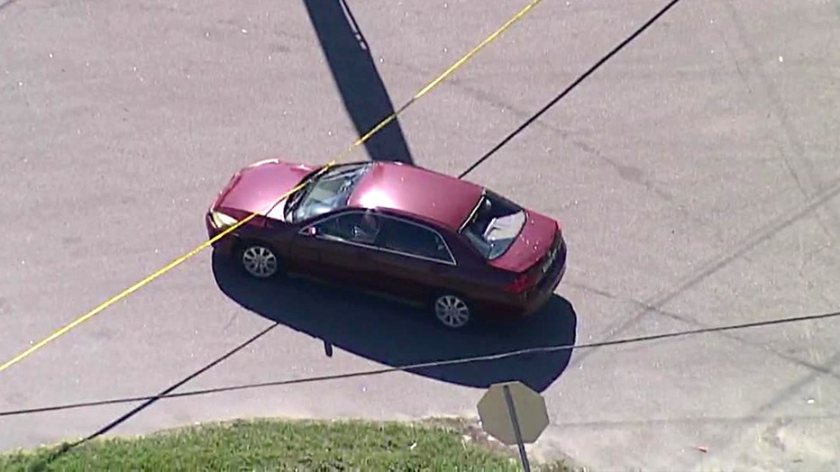 Aerial footage shows the red Honda involved in the Tampa crash. Police say the driver cut in front of the officer who was riding a motorcycle.