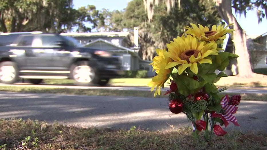 A small bouquet of flowers marks the spot where Kelly Hagan was hit and killed on her way to the Winter Haven Christmas boat parade.