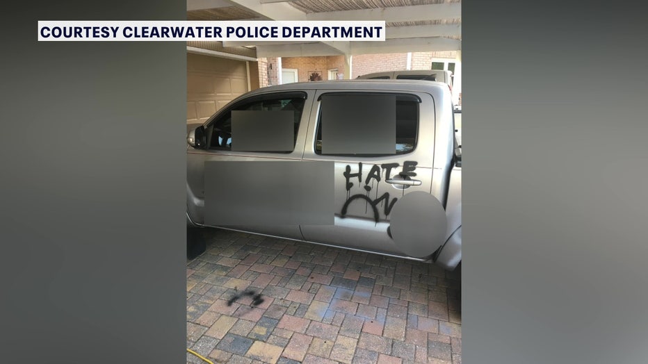 Two teens are accused of smashing vehicle windows, slashing tires and writing 'bigoted' messages. 