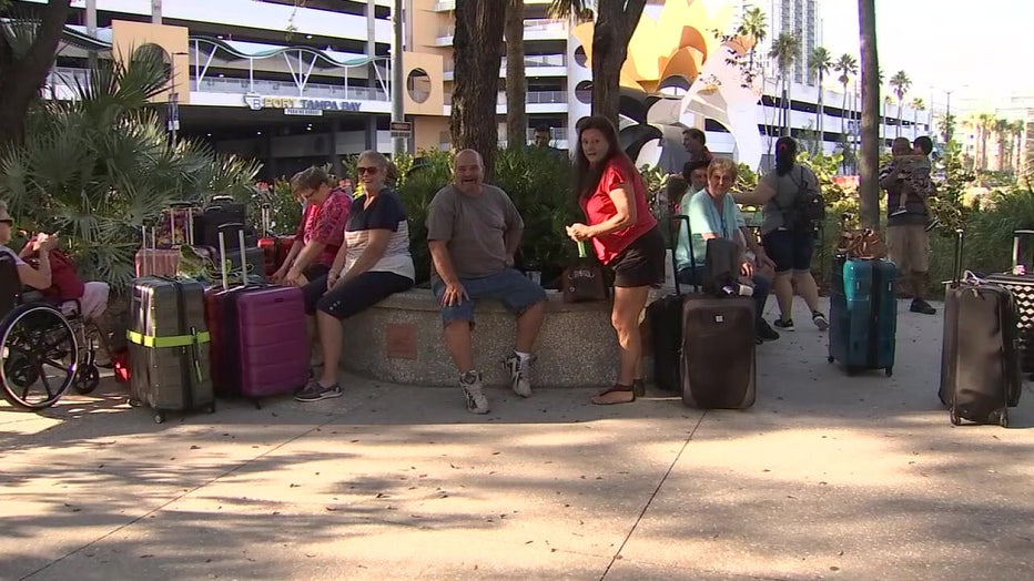 Travelers wait to board a cruise in Tampa. 