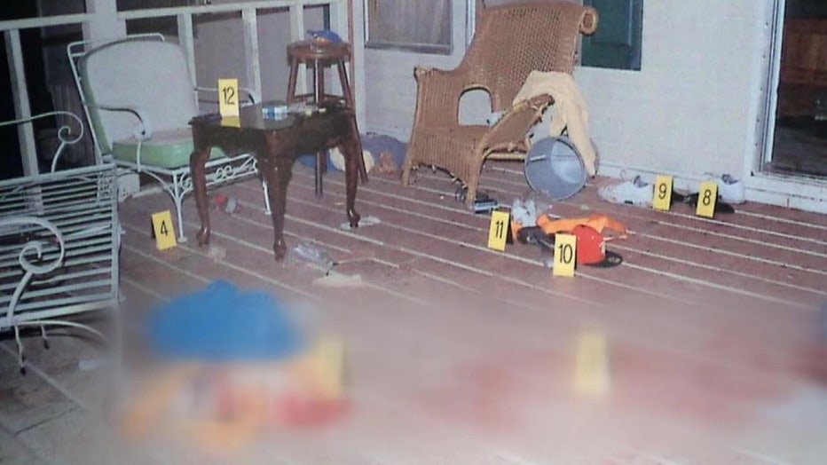 Evidence markers lie on the porch where Michael Keelty is accused of going on a shooting spree. 