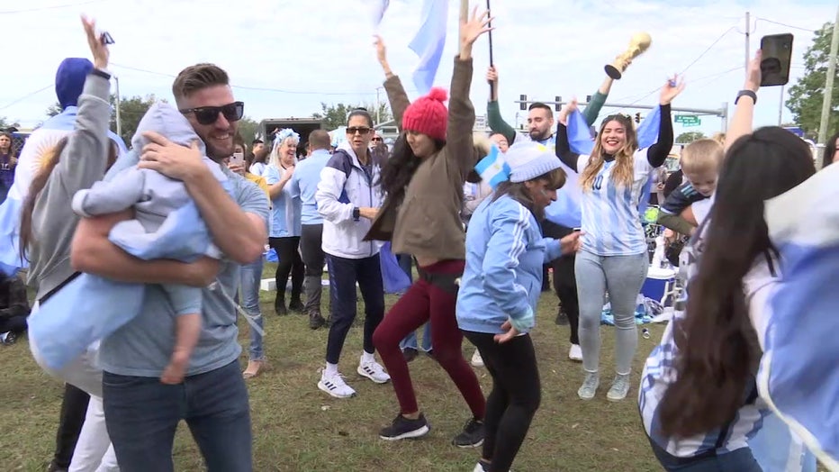 Fans cheering outside House Wife Panaderia Argentina in Tampa following a World Cup win. 