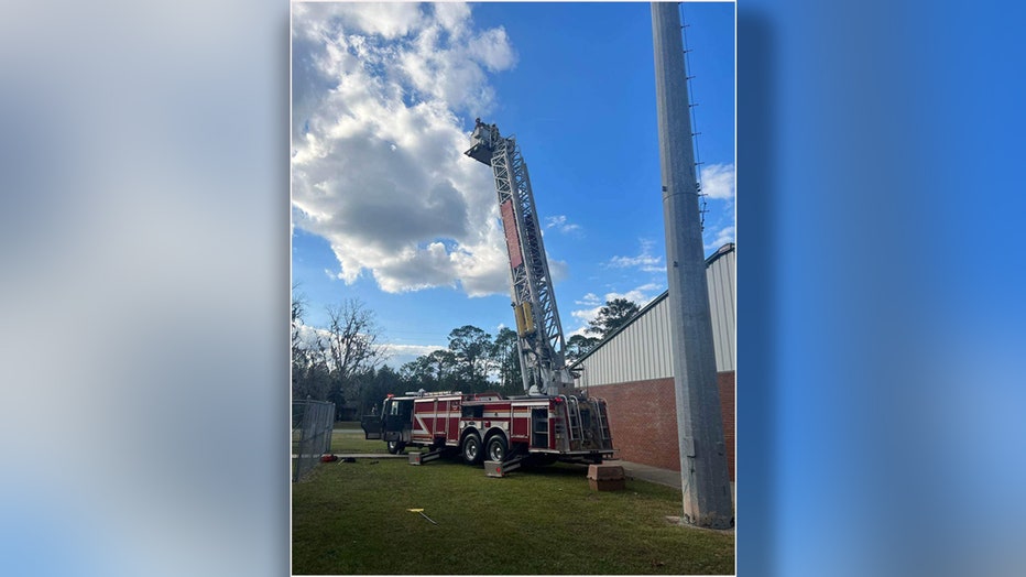 An eagle was rescued after being impaled by a lightning rod on top of an elementary school. Image is courtesy of the MacClenny Fired Rescue Department. 