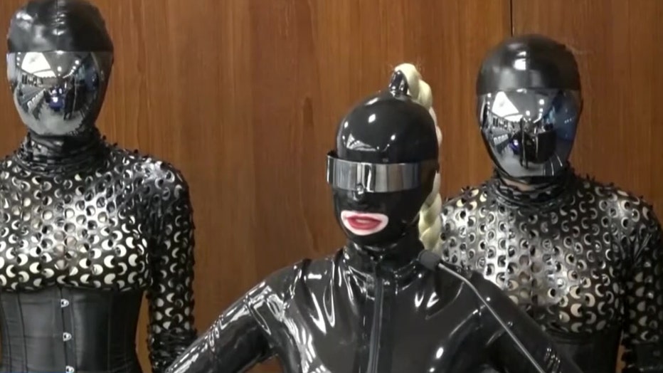 A trio of women clad in latex and leather appear before the Fort Lauderdale City Commission to propose the building of a dungeon.